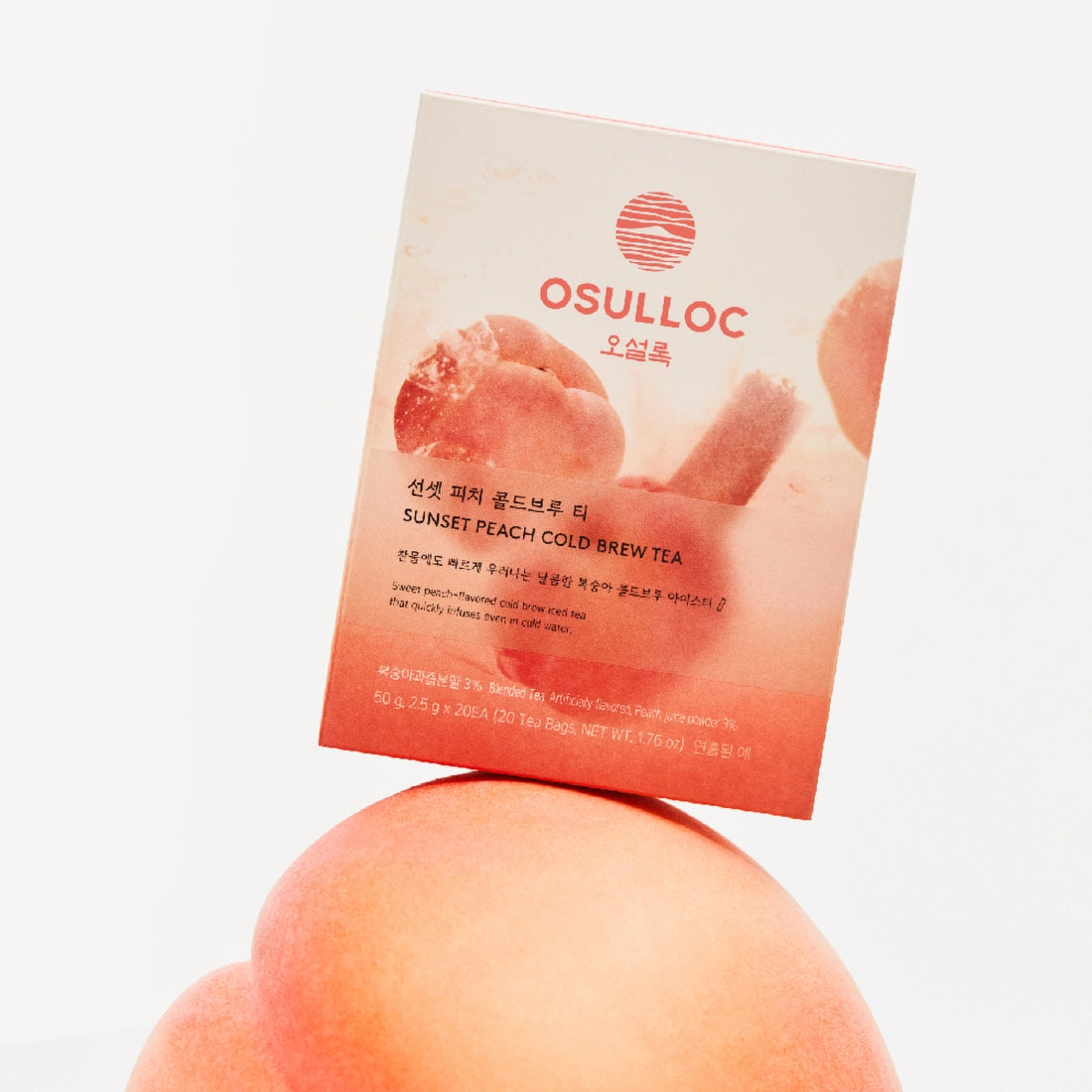 OSULLOC Sunset Peach Cold Brew Tea 20 P packaging on a peach background, highlighting the product's natural fruit infusion and elegance.