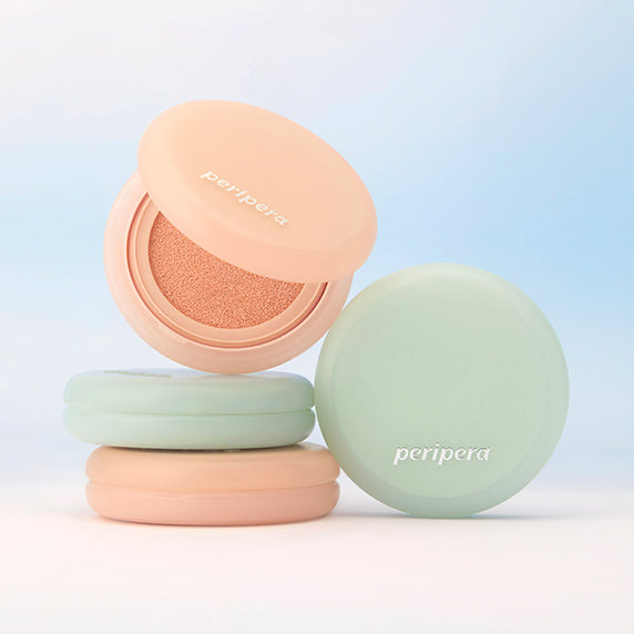 PERIPERA Filter Fit Milk Tone-Up Cushion in pastel packaging on display. Perfect for a radiant, even skin tone.