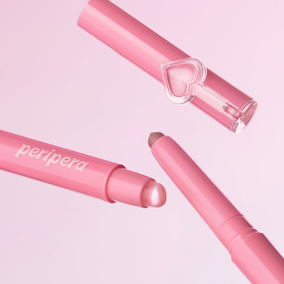 PERIPERA Puppy Plumping Dew Lip Pencil in pink, featuring a smooth texture and a playful heart design on packaging
