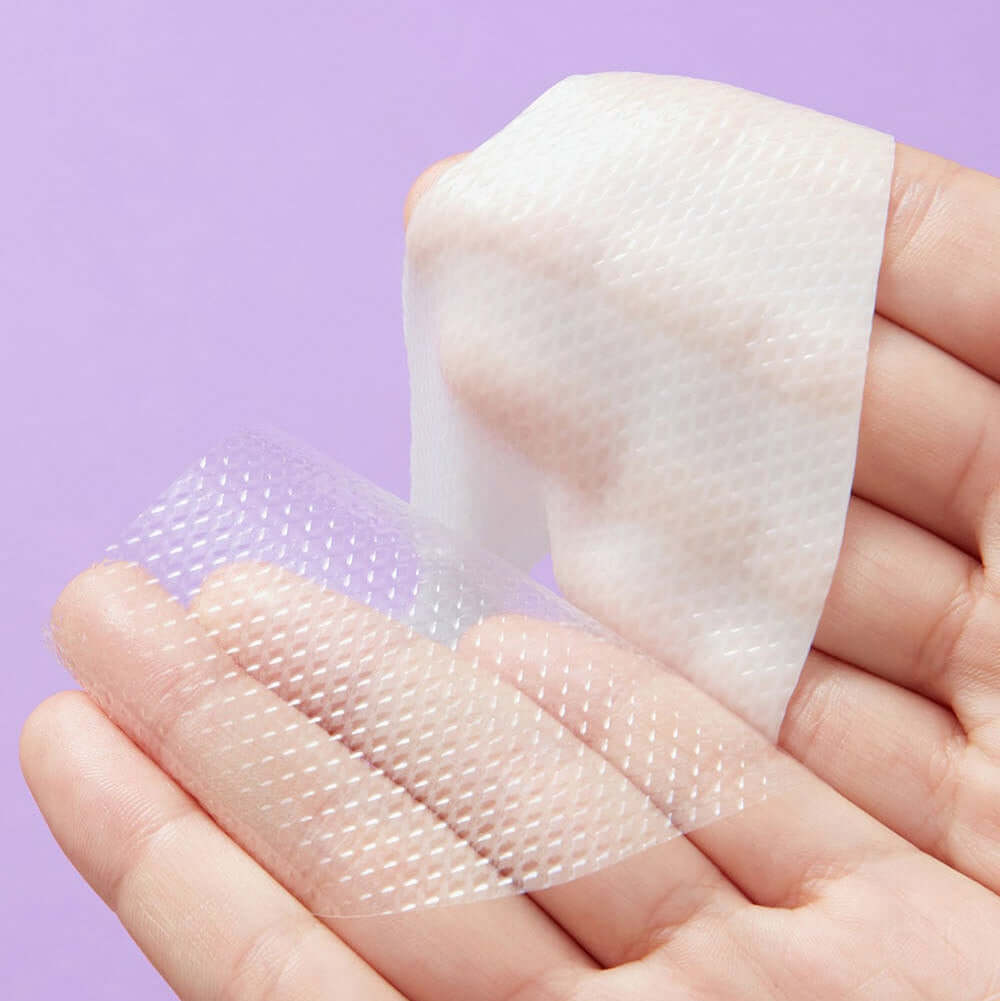 Close-up of REAL BARRIER Retinol Pore Tightening Serum Gel Mask x5 Sheets on a hand demonstrating its texture and design.