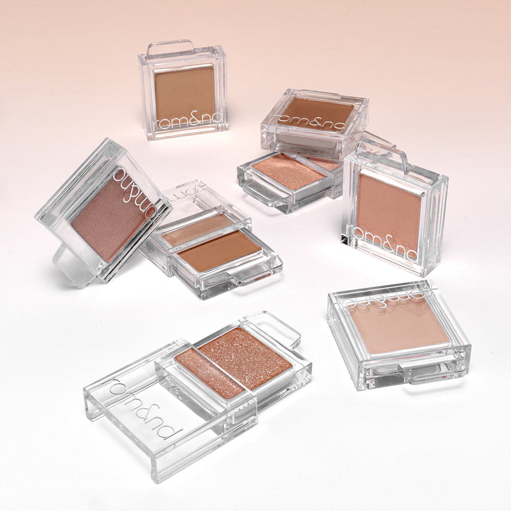 ROMAND Slide In Single eyeshadow collection displayed in various shades on a light background.