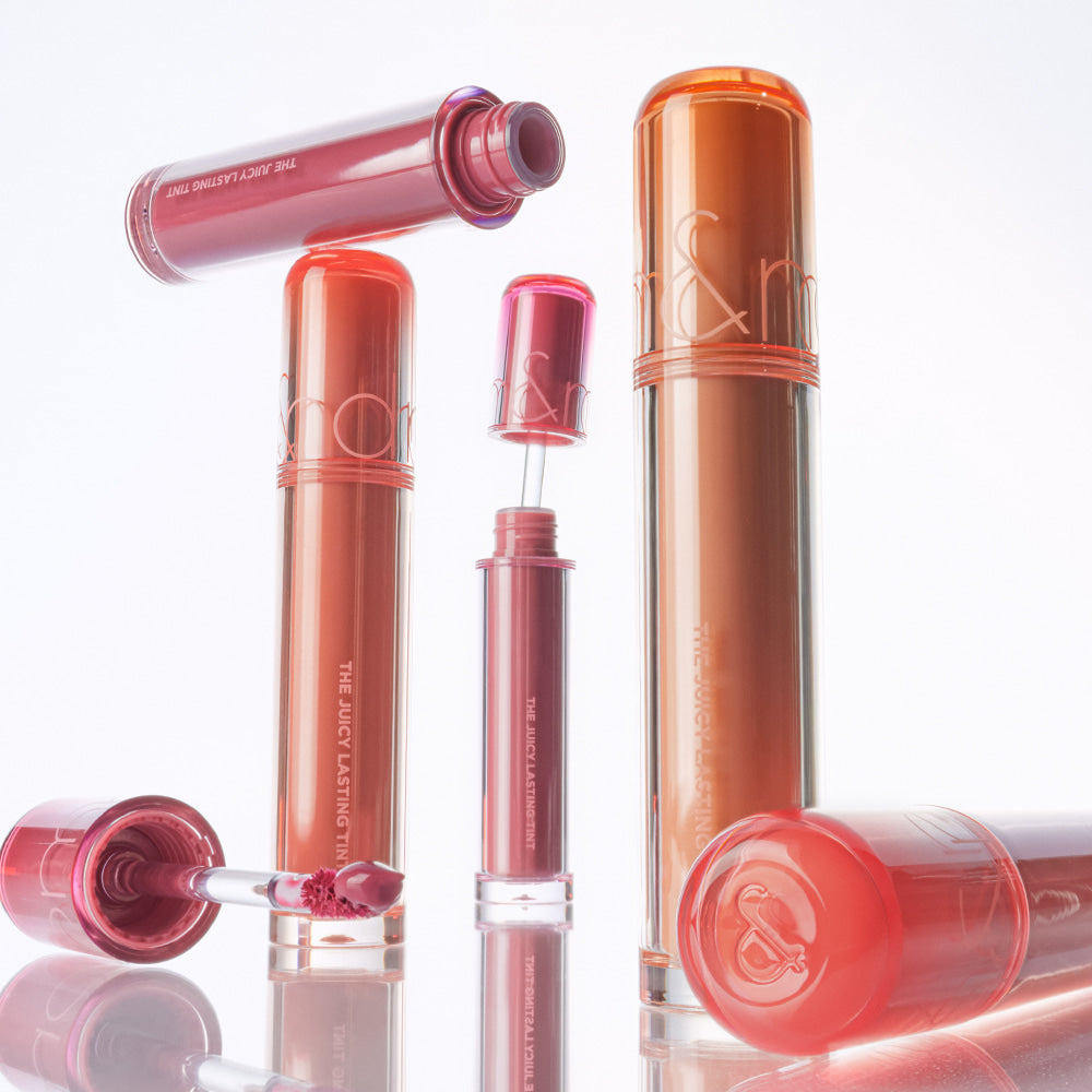 ROMAND The Juicy Lasting Tint displayed in various shades, showcasing vibrant lip colors.