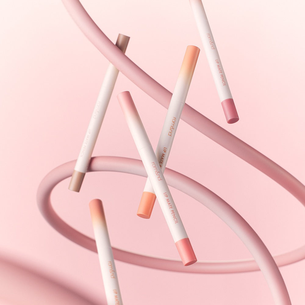 ROMAND lip mate pencil #beovershade displayed artistically with pink background