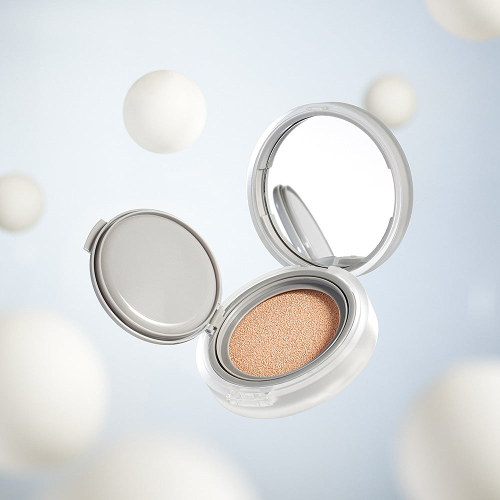 ROMAND nu zero cushion in an open compact against a soft, dreamy background.