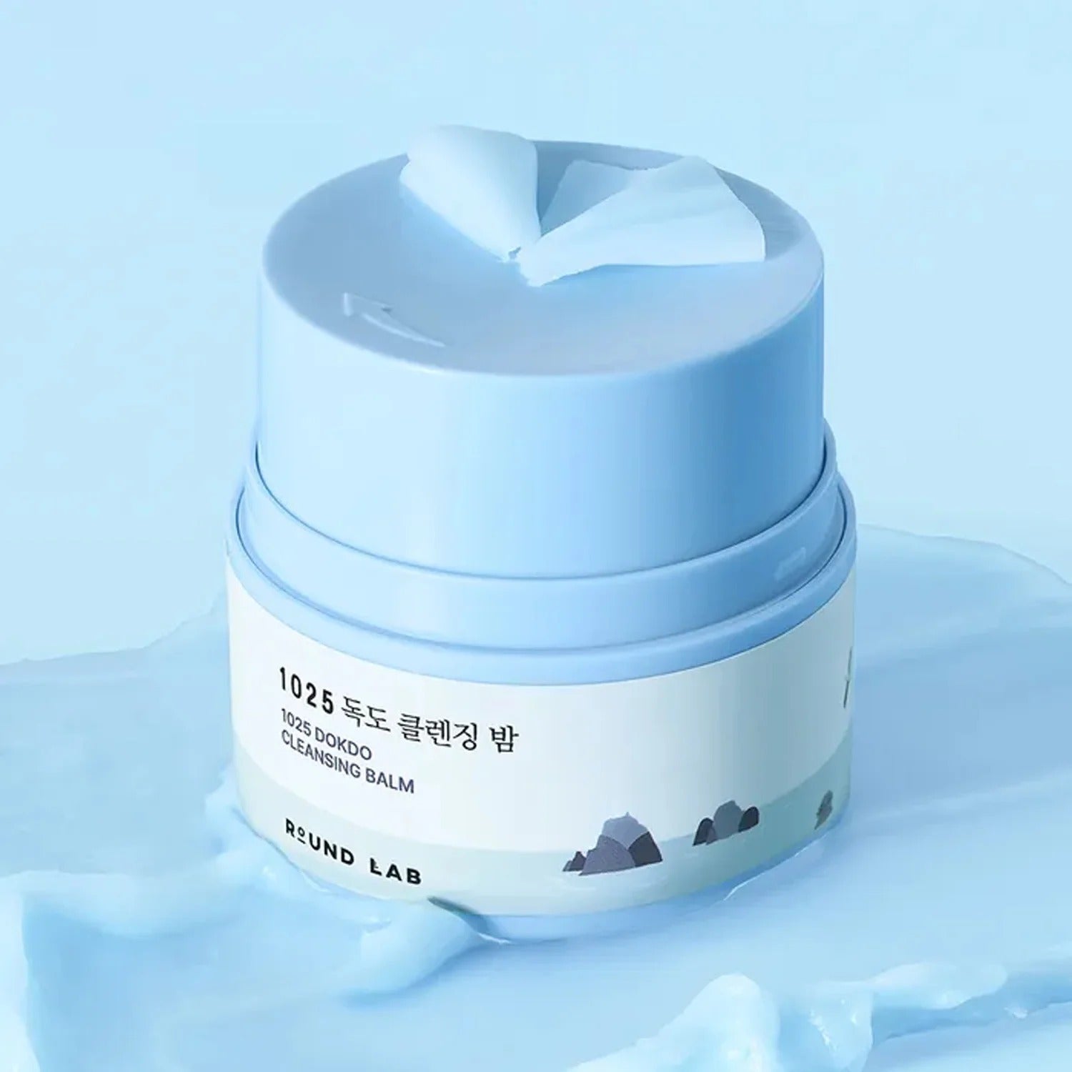 ROUND LAB 1025 Dokdo Cleansing Balm 50ml in blue jar on a soft background