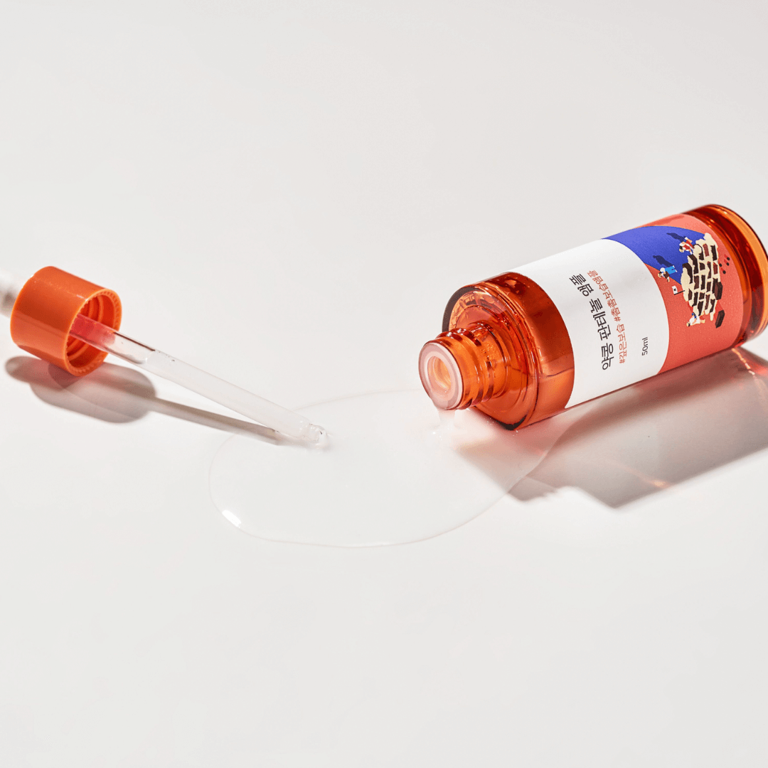 ROUND LAB Pine Calming Cica Ampoule 30ml bottle with dropper on a white background, highlighting the ampoule's calming properties.
