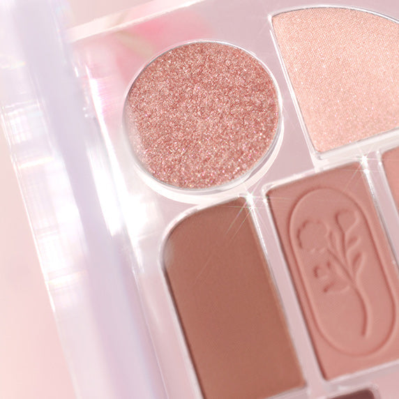 Close-up of SIM;PLAIN Eye Palette featuring neutral and shimmer shades for versatile eye makeup looks.
