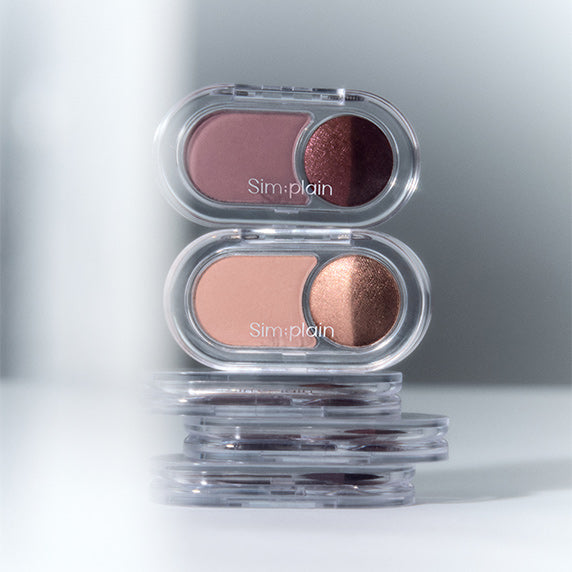 SIM;PLAIN Gleam On Eyes dual eye shadow palette with shimmering tones in stackable cases for a stylish look.