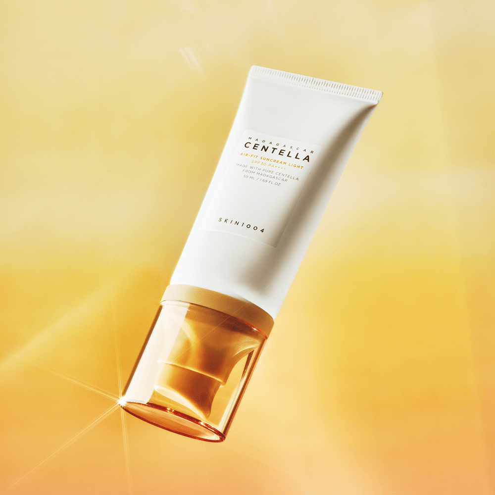 Image of SKIN1004 Madagascar Centella Air-fit Sunscreen Light 50ml against a golden background.