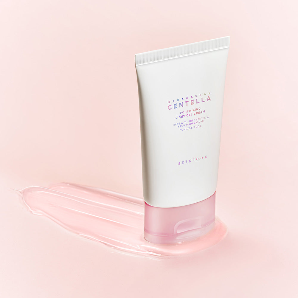 SKIN1004 Madagascar Centella Poremizing Light Gel Cream 75ml on a pink background, showcasing the product's sleek packaging.