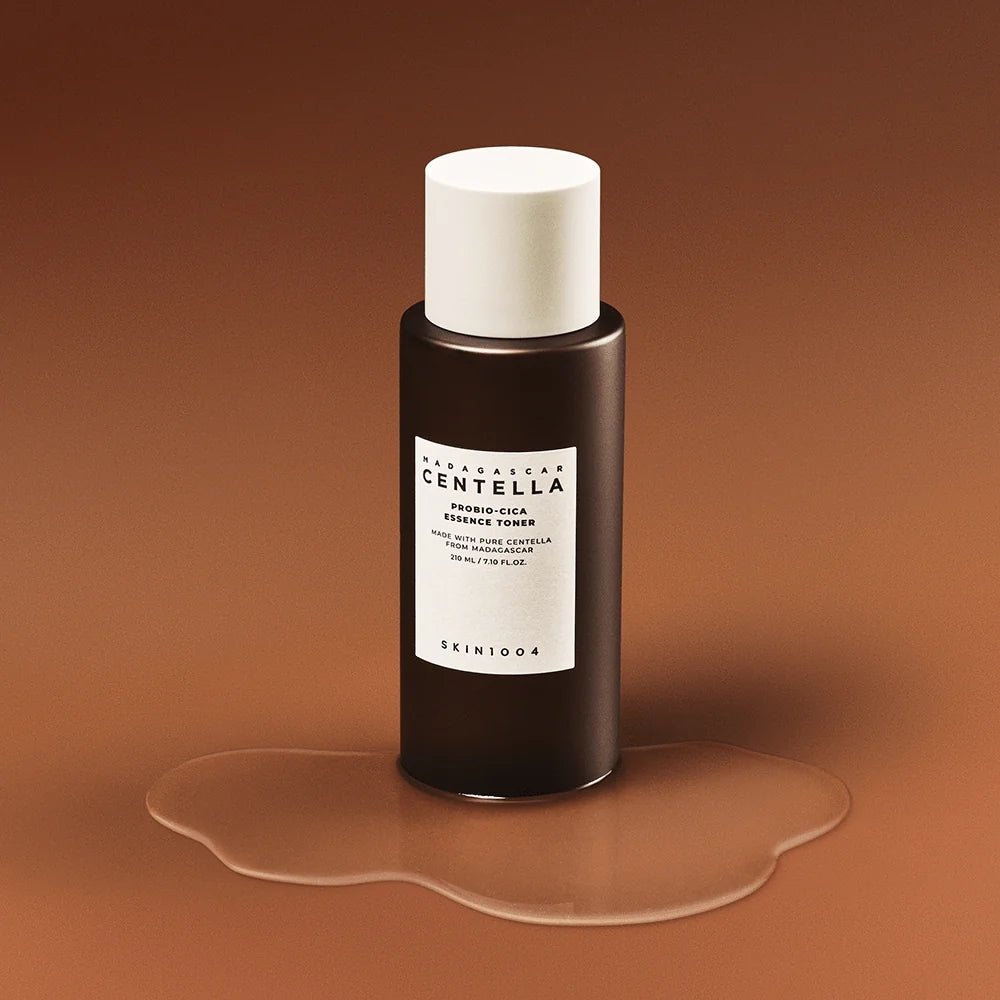 SKIN1004 Madagascar Centella Probio-cica Essence Toner 210ml bottle on a brown background.