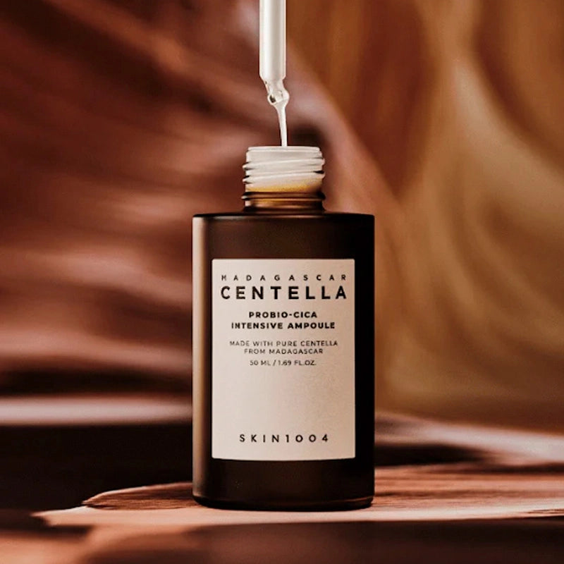 SKIN1004 Madagascar Centella Probio-cica Intensive Ampoule 50ml on wooden surface with dropper above.