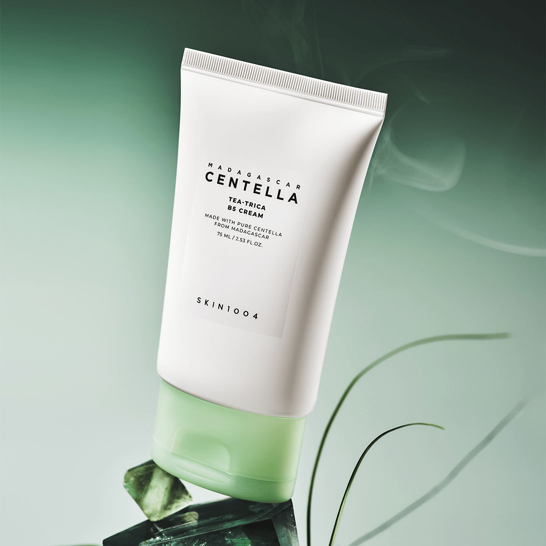 SKIN1004 Madagascar Centella Tea-trica B5 Cream 75ml on a green background with leaves