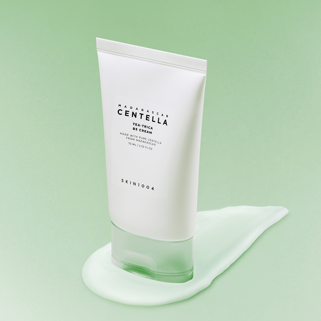 SKIN1004 Madagascar Centella Tea-trica B5 Cream 75ml tube on a green background with cream smear underneath