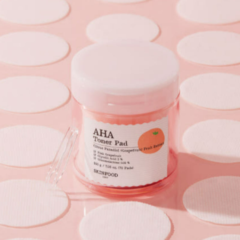 SKINFOOD Pink Grapefruit AHA Toner Pad 70 sheets on pink background