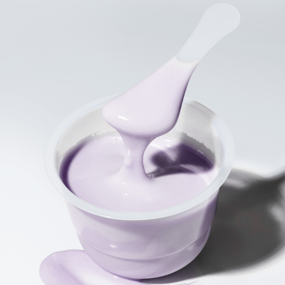 SUNGBOON EDITOR Boosting Modeling Pack Meoru Podo Brightening in container with spatula, featuring smooth purple cream texture