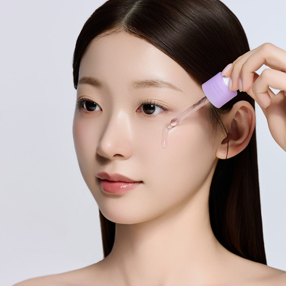 Woman applying SUNGBOON EDITOR Grape Vita C Dark Spot Whitening Ampoule 40ml to skin