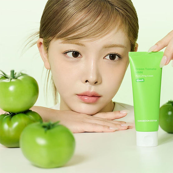 SUNGBOON EDITOR Green Tomato NMN Pore Lifting Cream 50ml held by a woman with fresh green tomatoes