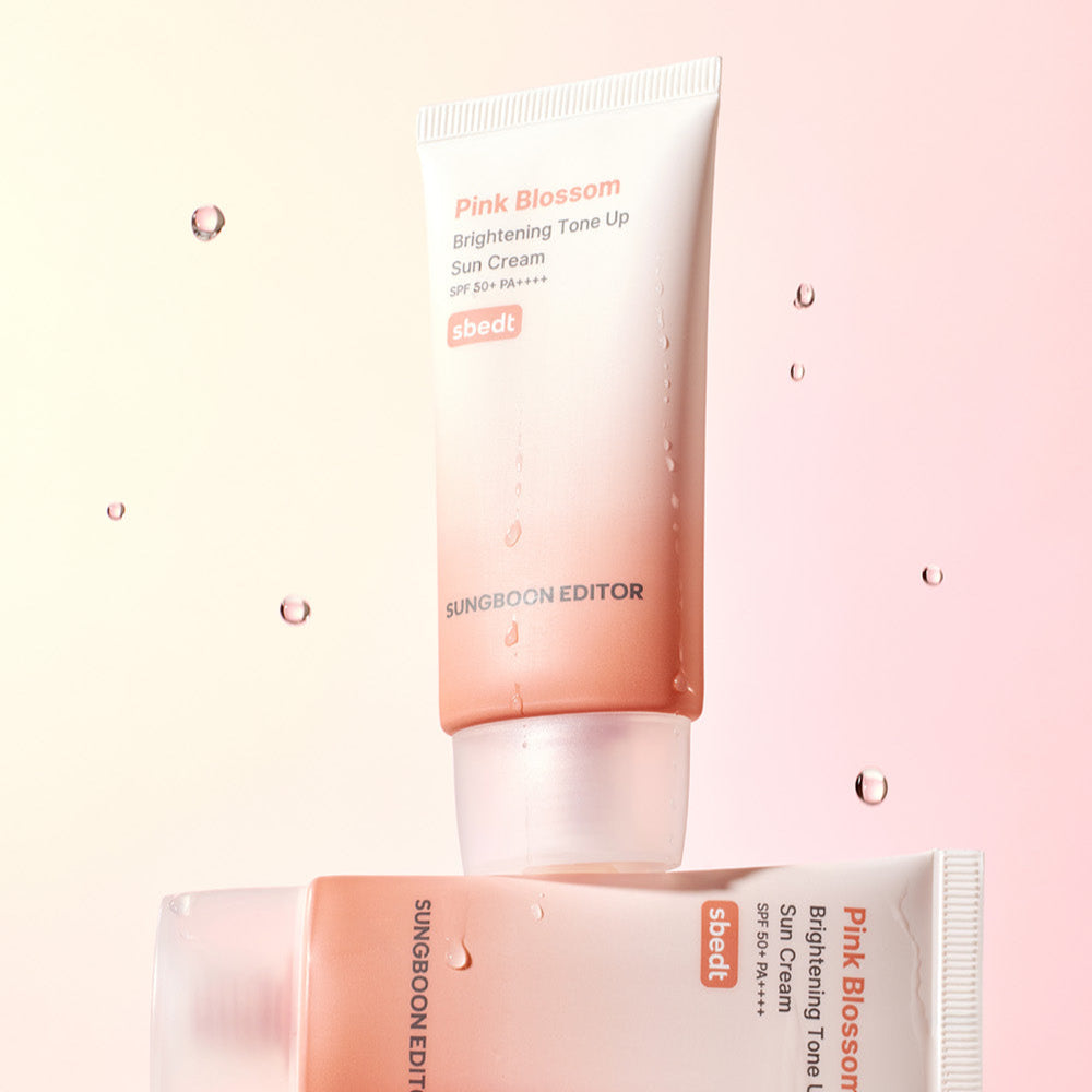 SUNGBOON EDITOR Pink Blossom Brightening Tone-Up Sunscream 50ml displayed with soft pink background and water droplets.