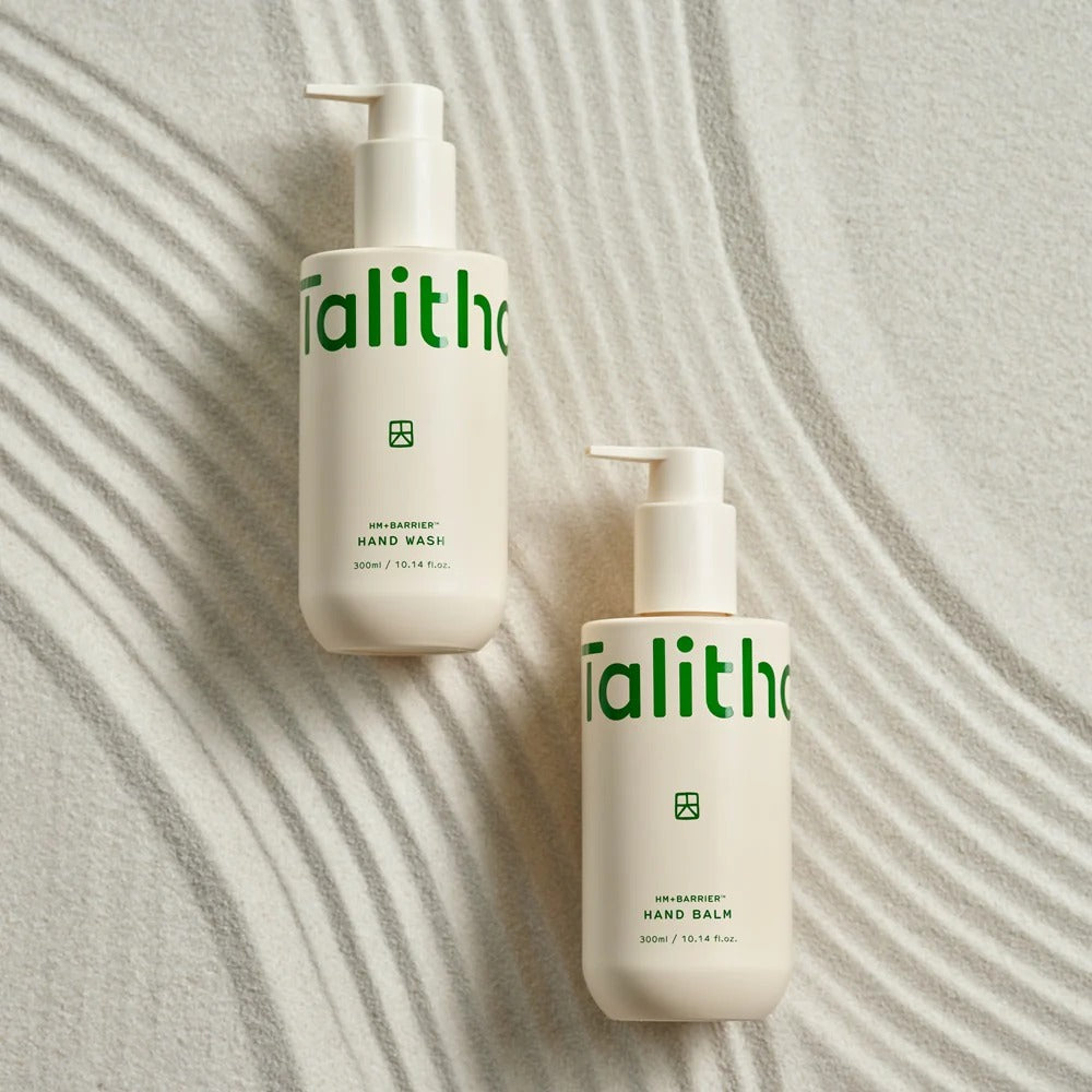 TALITHA KOUM HM+Barrier Hand Wash 300ml and Hand Balm bottles on a textured surface