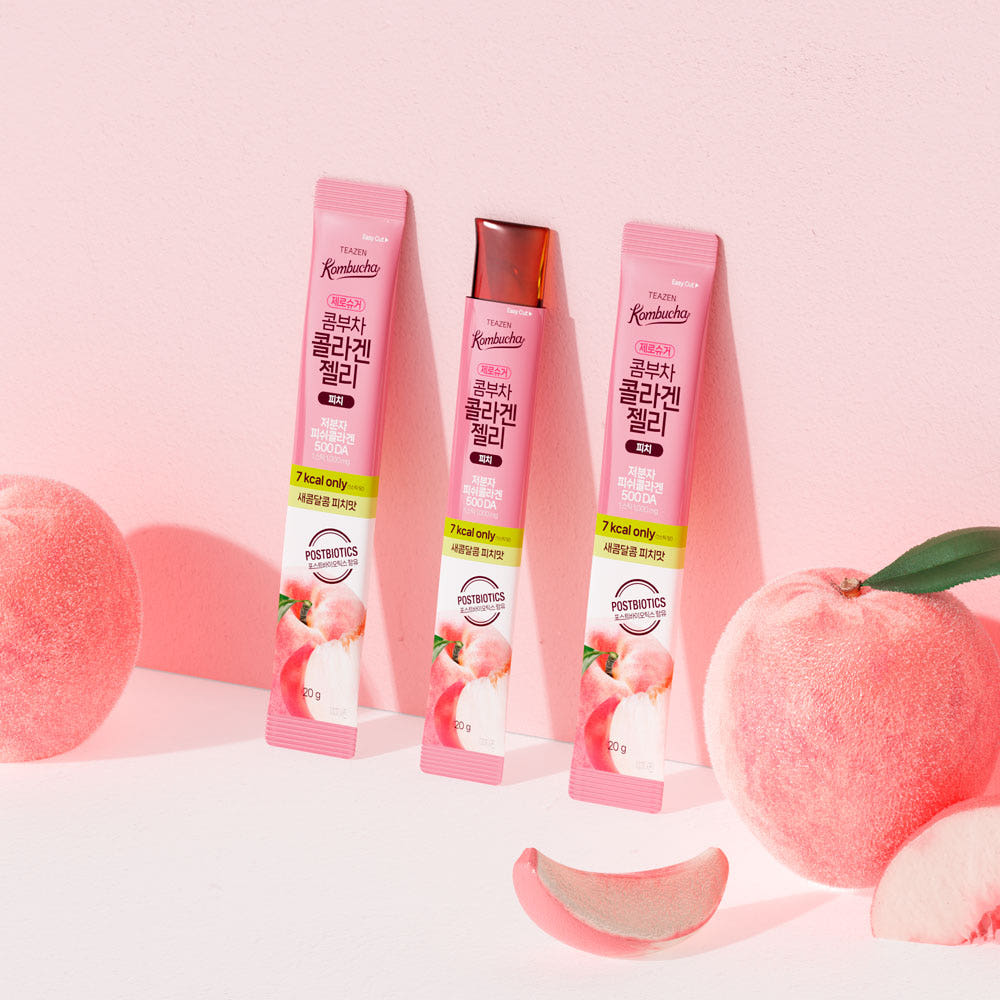 TEAZEN Kombucha Collagen Jelly Peach 14 Sticks on display with fresh peach background