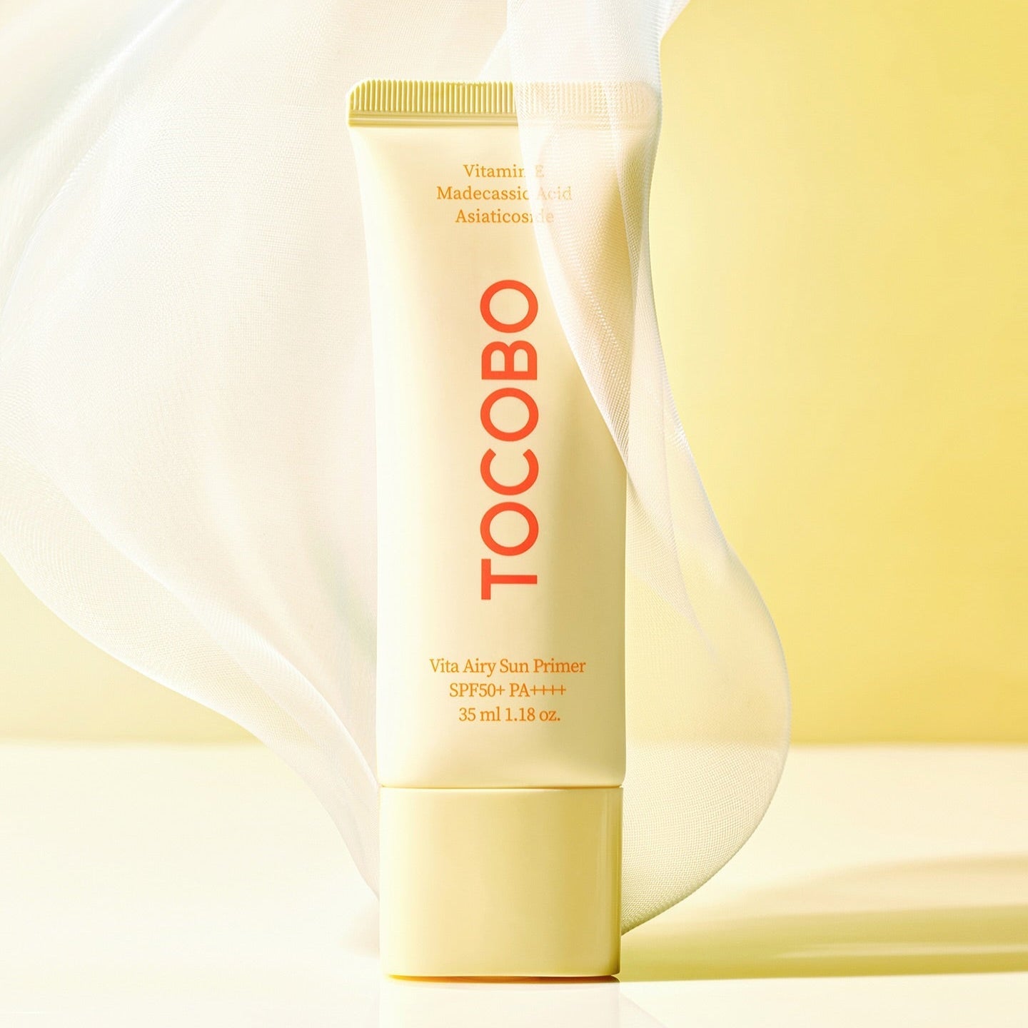 TOCOBO Vita Airy Sun Primer 35ml on a light background with fabric detail, highlighting its SPF50+ protection and airy formulation.