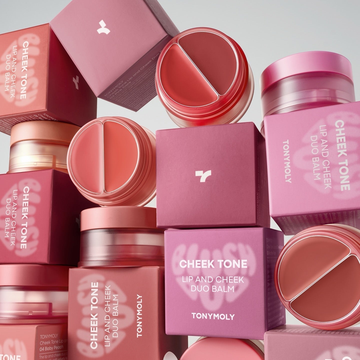 Stack of TONY MOLY Cheek Tone Lip & Cheek Duo Balm in various shades with packaging
