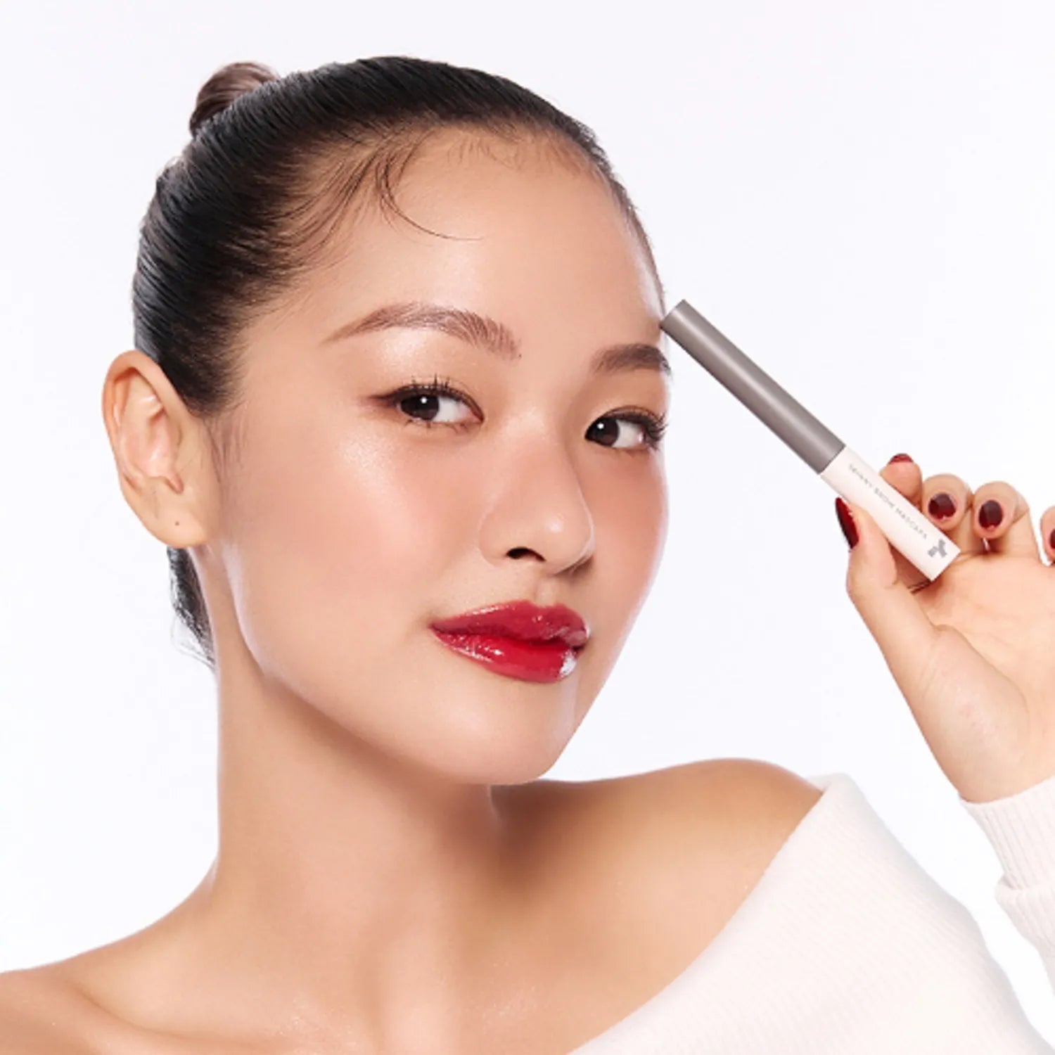 Model showcasing TONY MOLY Eye Tone Skinny Brow Mascara for perfectly defined brows.