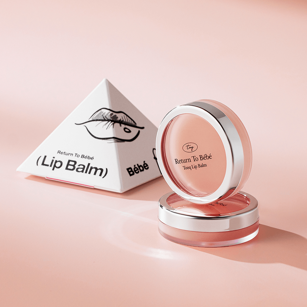 TOOQ Return To Bèbè Lip Balm in elegant packaging, featuring a sleek pink container and eye-catching design.