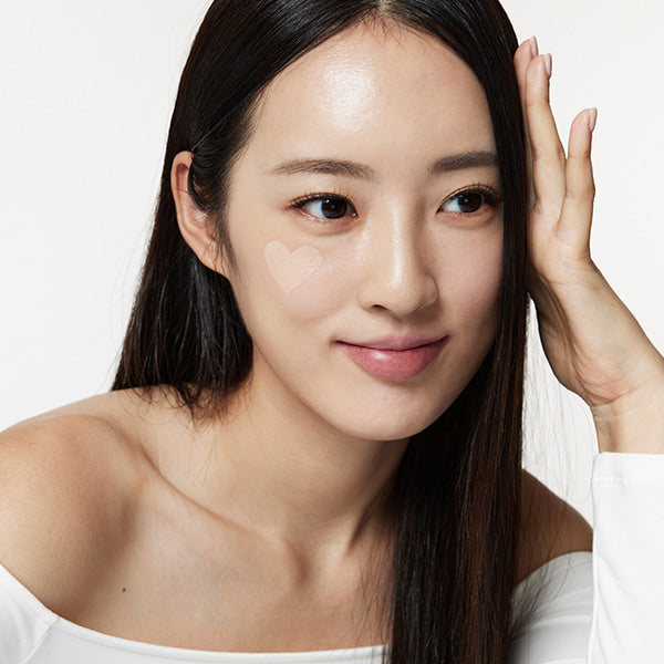 Woman applying TOUCH IN SOL Pretty Filter In My Heart Stick Foundation