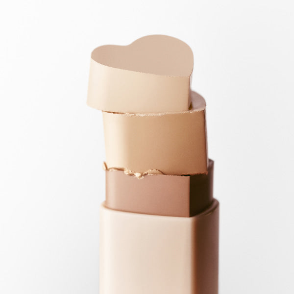 TOUCH IN SOL Pretty Filter In My Heart Stick Foundation product image with heart-shaped top displaying creamy beige shades.