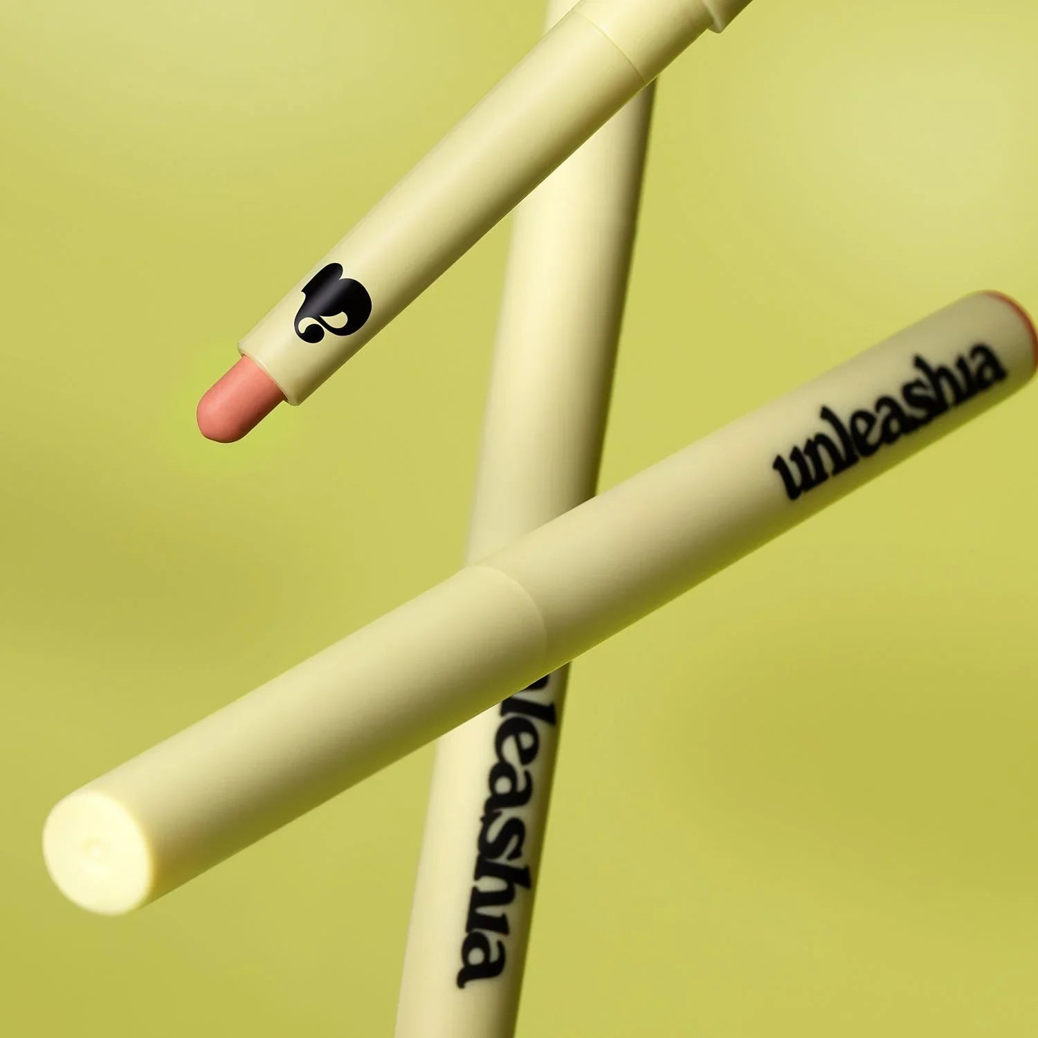 UNLEASHIA Oh! Happy Day Lip Pencil on a green background