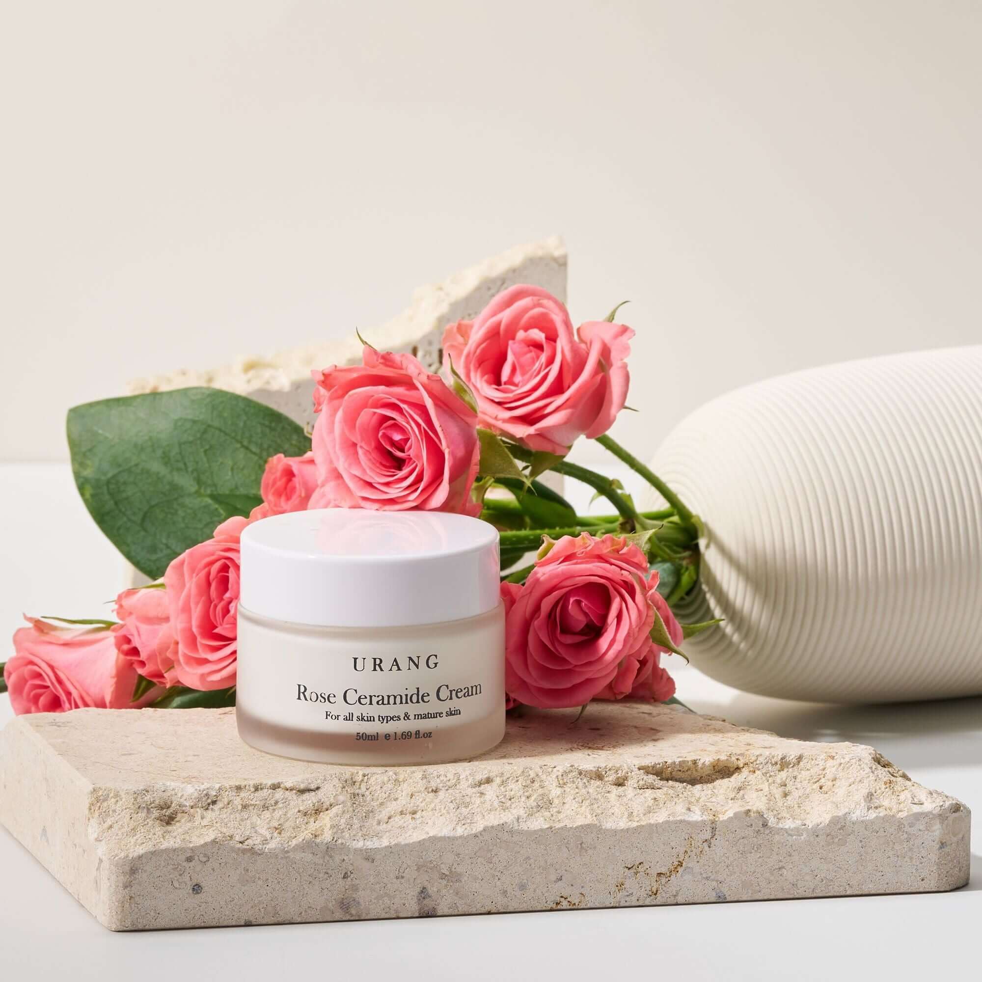 URANG Rose Ceramide Cream 50ml jar with pink roses, highlighting skincare benefits.