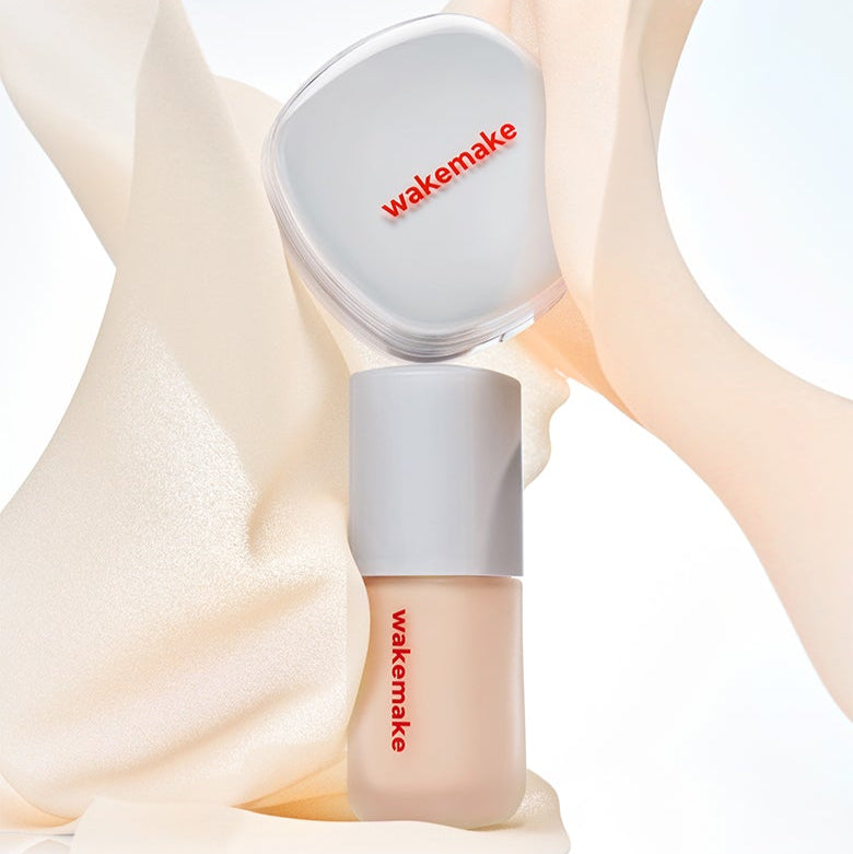 WAKE MAKE Seamless Wear Foundation 30ml against a soft fabric backdrop