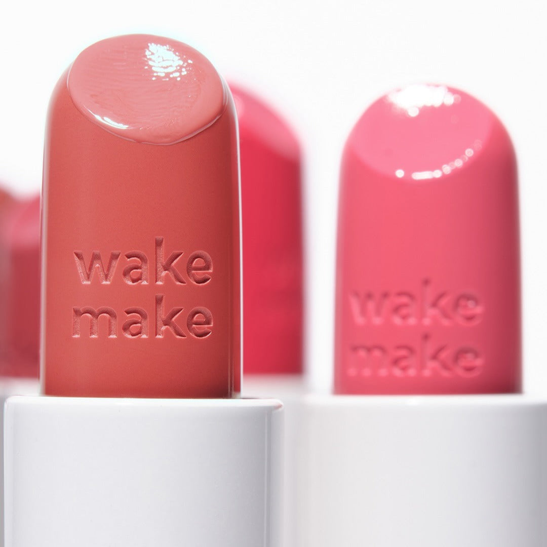 Close-up of WAKEMAKE Healthy Glow Balm Sticks in vibrant pink and coral shades.