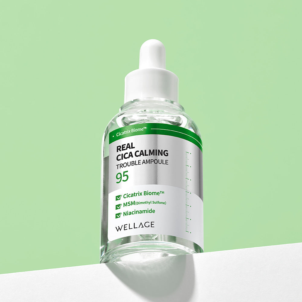WELLAGE Real Cica Calming 95 Trouble Ampoule 50ml on a green background
