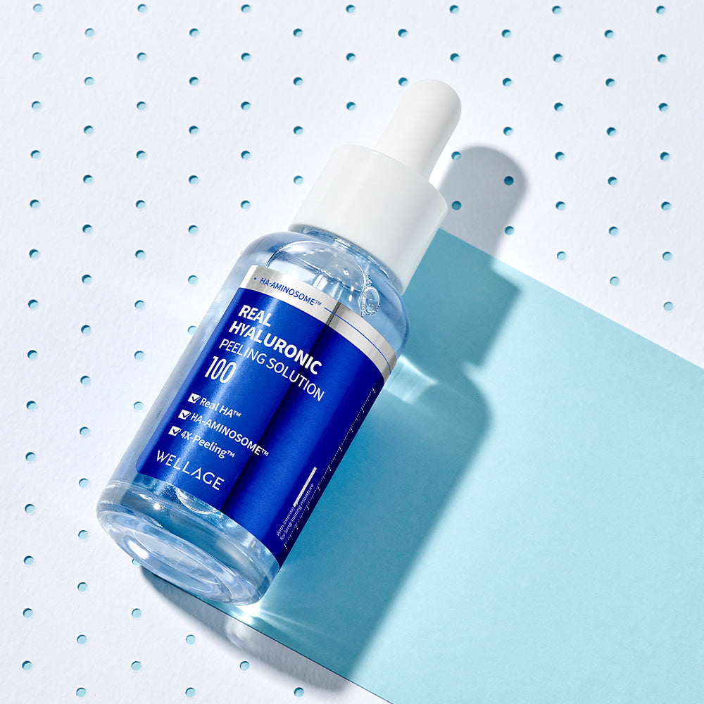 WELLAGE Real Hyaluronic Peeling Solution 30ml bottle on a blue background, skincare product, hydrating exfoliant