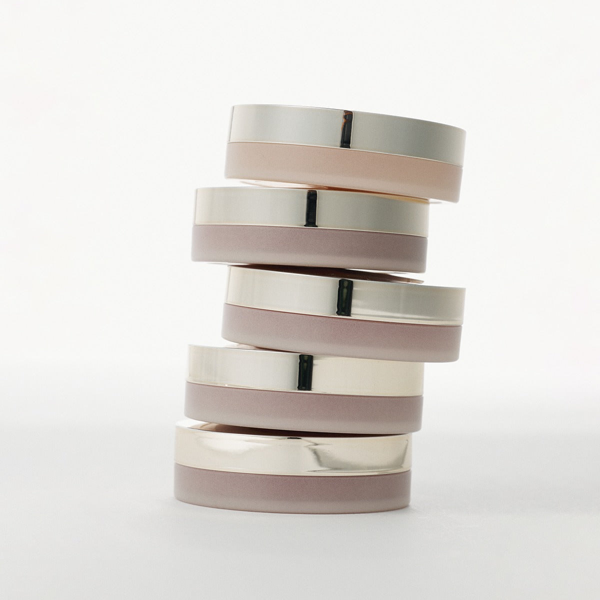 Stack of XOUL Ever Moist Volume Lip Balm 8g in silver and beige packaging