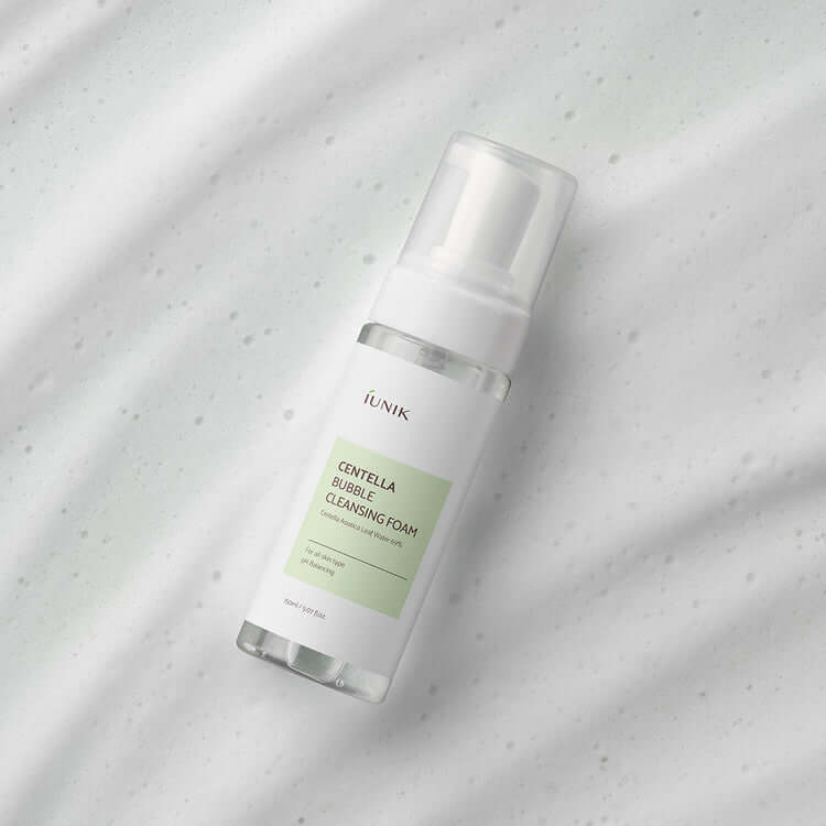 iUNIK Centella Bubble Cleansing Foam 150ml bottle on marble surface