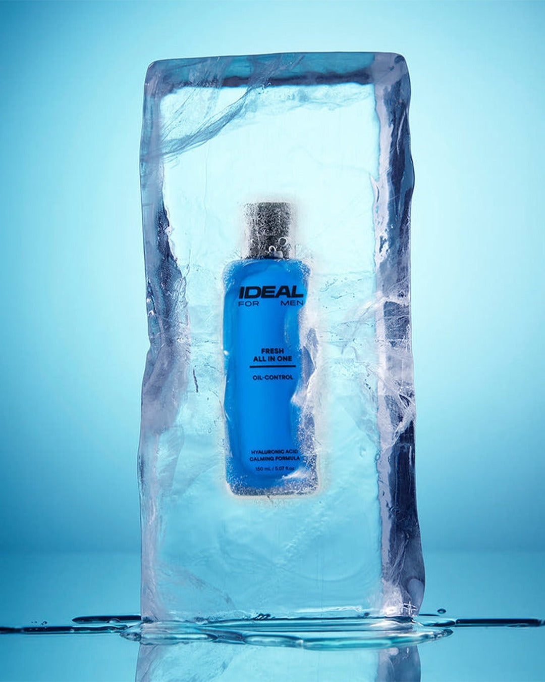 Blue Ideal For Men Fresh All In One bottle encased in ice against a blue background.