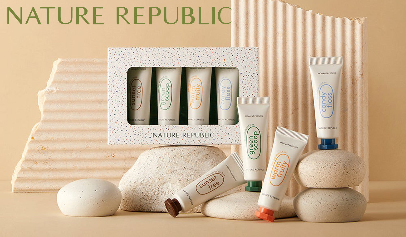 Nature Republic skincare set displayed on stones with textured backdrop.