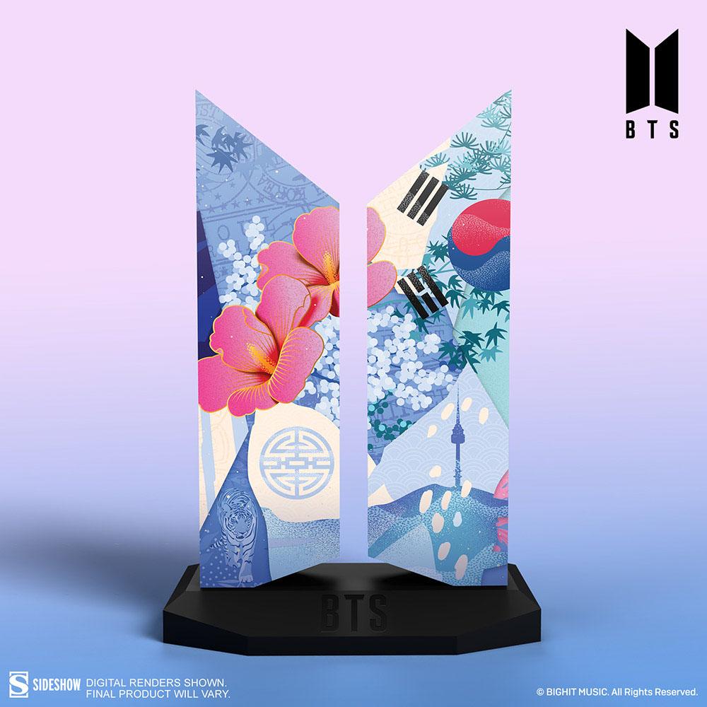 BTS-themed decorative display with vibrant floral and abstract design elements on a black base, featuring the BTS logo.
