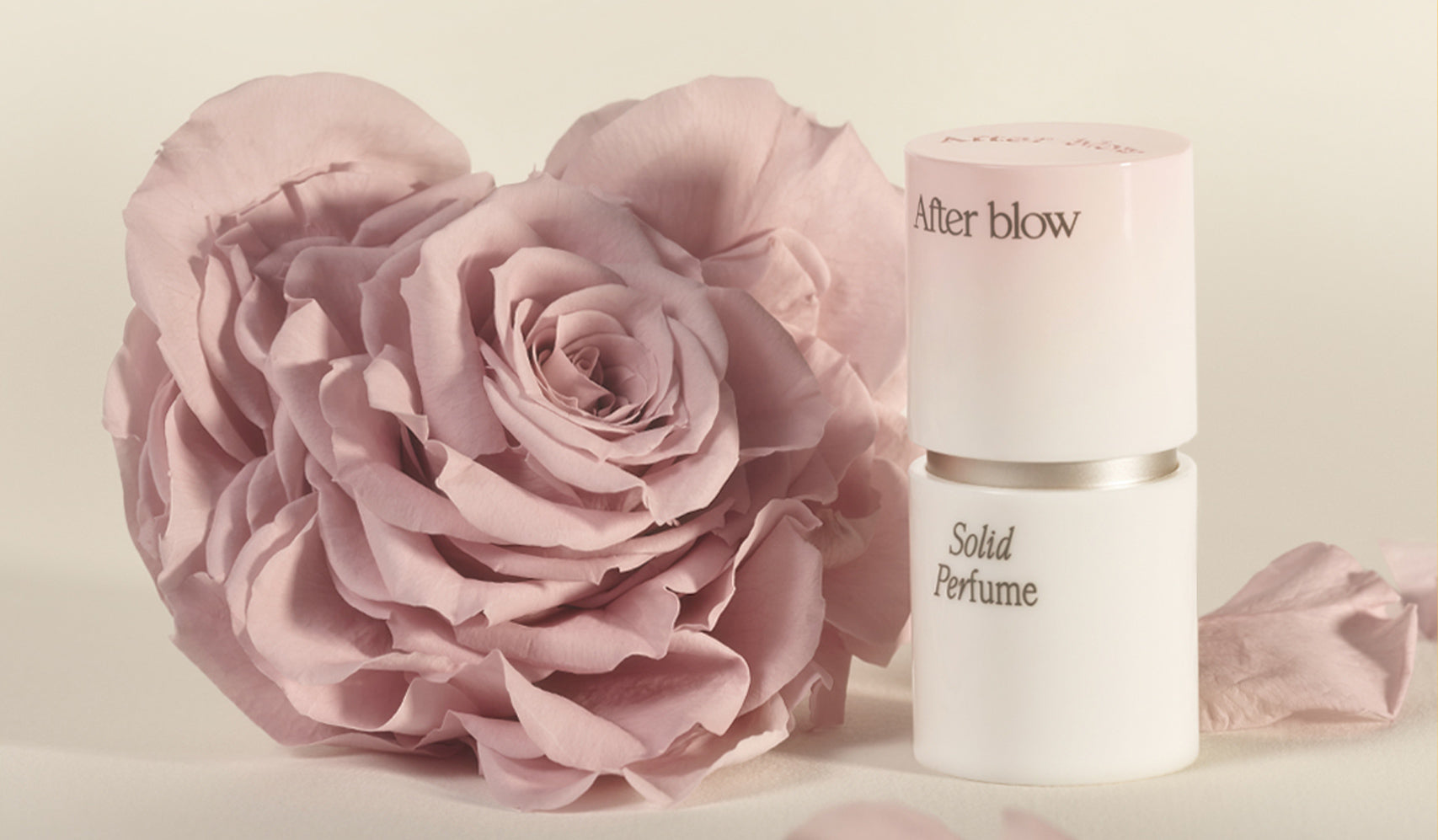 AFTER BLOW: The Korean Brand Revolutionizing Modern Fashion with a Cultural Twist featuring a solid perfume and pink rose.