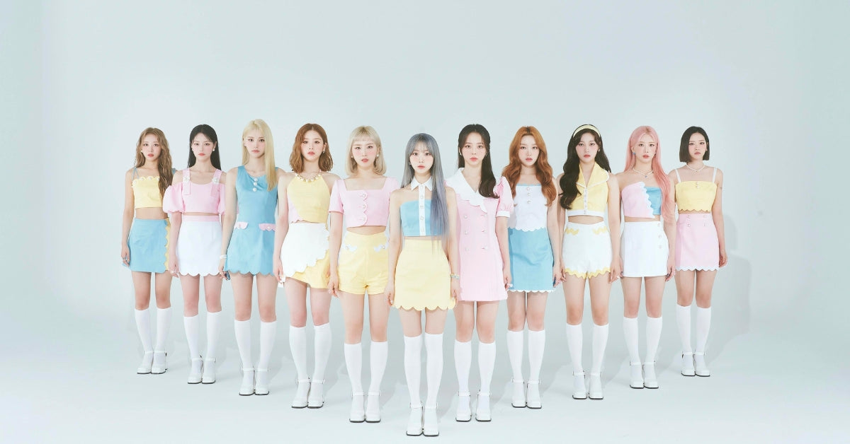 LOONA: The Dynamic Girl Group Redefining K-Pop with Innovation and Charm! standing together in colorful outfits.