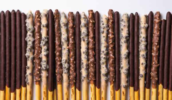 Explore the Delicious World of LOTTE: A Taste of Korean Snack Culture with chocolate-covered stick snacks.