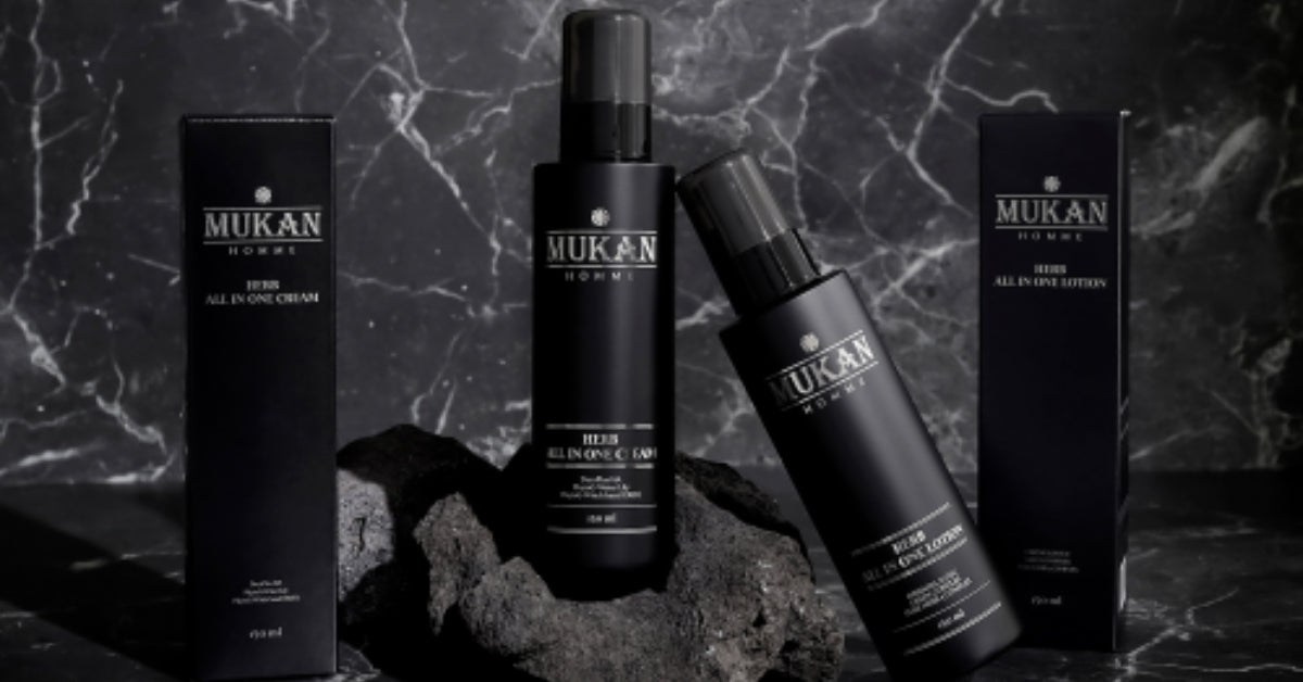 Mukan Korea Men: Elevate Your Hair Game and Style with Natural Confidence! product lineup on stone surface.