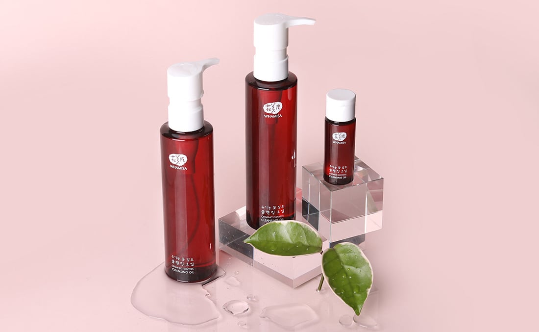 Unveiling WHAMISA: The Essence of Organic Luxury in Korean Skincare - premium skincare products displayed elegantly with natural elements.
