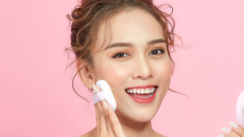 Staying Connected to Beauty: Unveiling the Charm of KEEP IN TOUCH Korean Skincare - Woman using skincare product on pink background