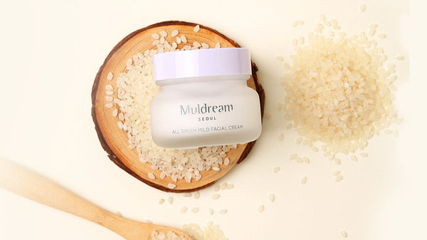 Embracing Dreamy Skincare: Unveiling the Magic of MULDREAM in Korean Beauty, featuring a facial cream with rice grains.
