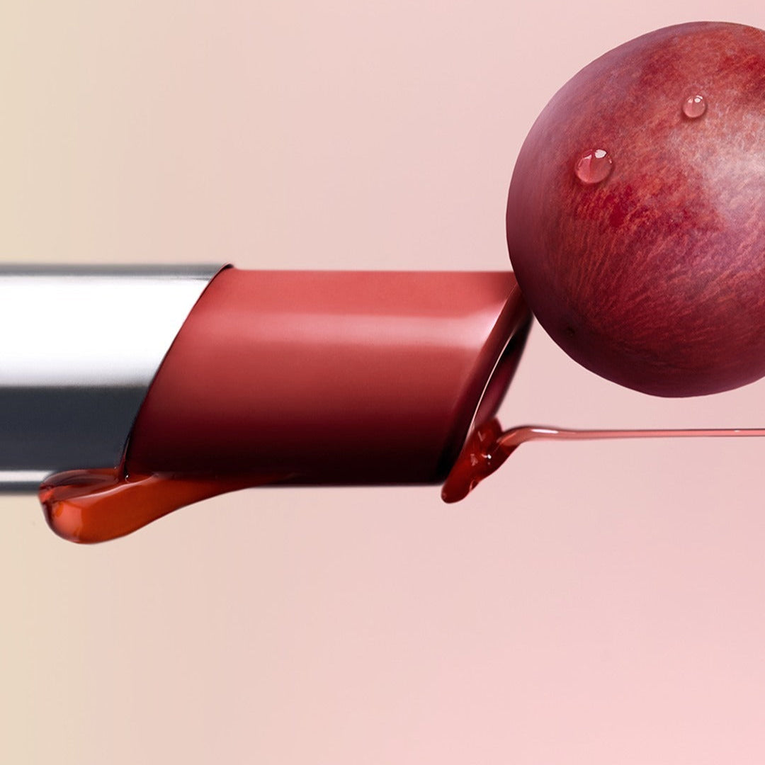 3CE Glaze Lip Glow 3.2g lipstick with glossy texture and grape accent, showcasing vibrant color and hydration features.